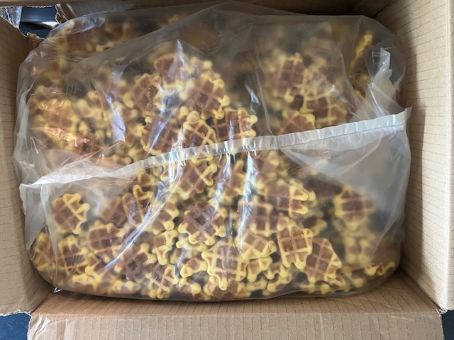 Bulk bag of waffle bites in a shipping case
